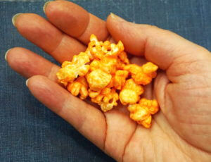 A handful of 'sweet' cheddar popcorn