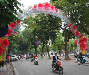 A decorative holiday arch over a highway in Hanoi