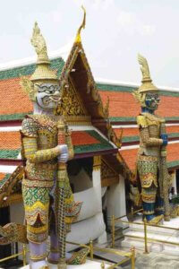 Giant Yak figures stand guard inside the Grand Palace
