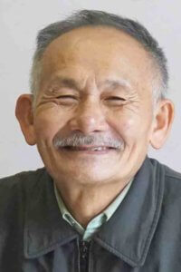 Khai's father, Tinh, the family patriarch