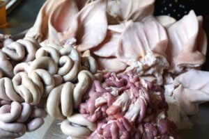Intestines, pigs' ears and other animal parts for sale at a Vietnamese market