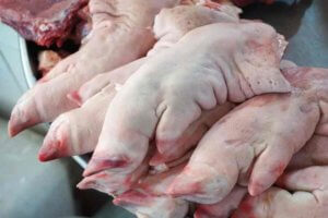 Freshly butchered pigs' feet for sale at a Vietnamese market