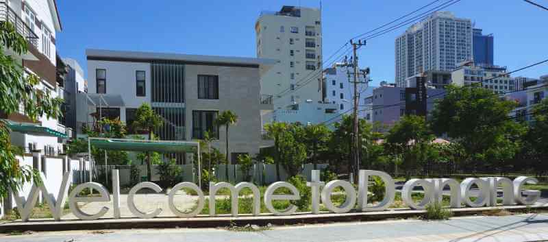 Welcome sign in Danang Vietnam with blue sky overhead