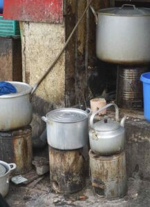 Coal-fired cookers at a streetside food stall in Hanoi Vietnam