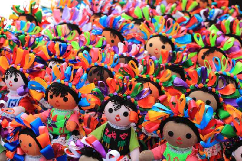 A sea of handmade dolls willingly smile for my camera at the craft market in San Cristobal de las Casas