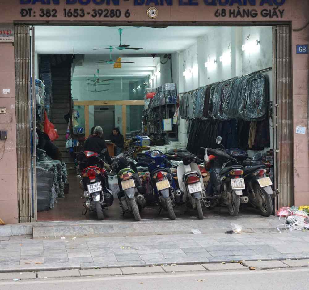 Motorcycles are often parked inside the first floor of shops and homes