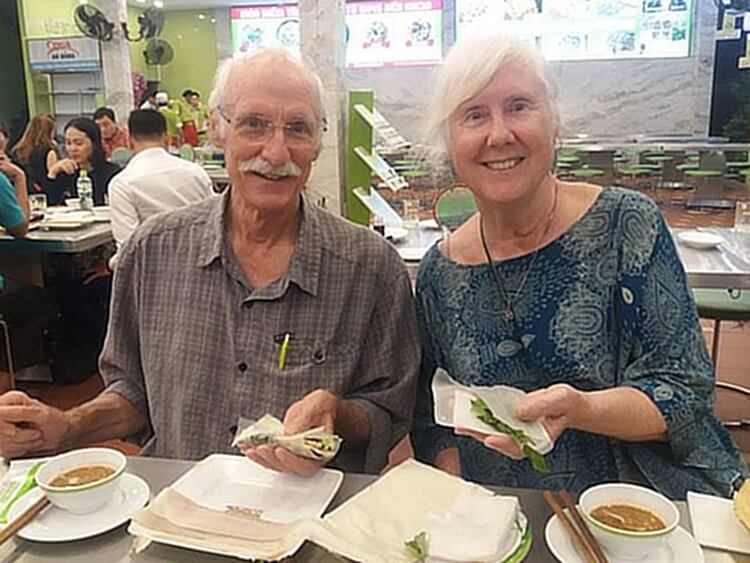 John and Melanie enjoy a typical Vietnamese meal in Danang (photo courtesy Michael Caven/Tran Restaurants)