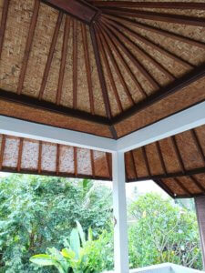 Our covered porch ceiling made of woven bamboo