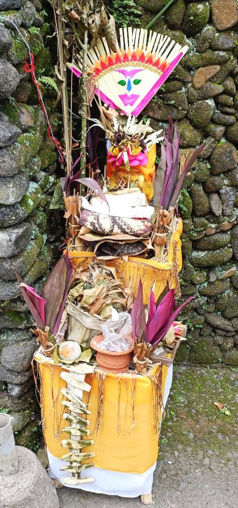 Small altar loaded with prayer offerings near our Bali villa