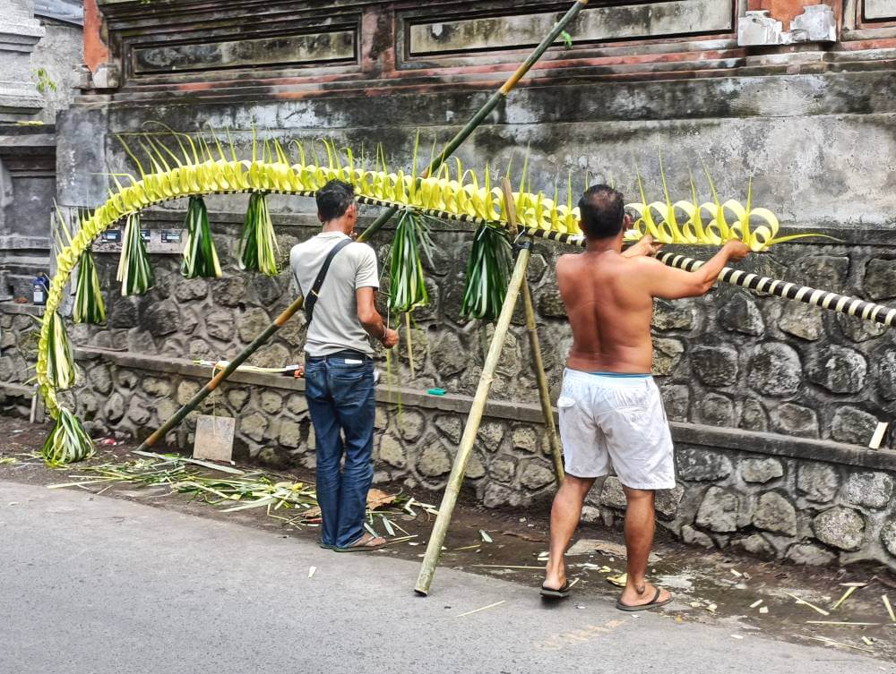 Assembling a Galungan penjor in Bali, Indonesia