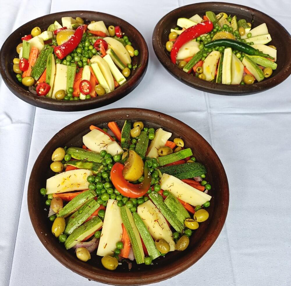 Colorful tajines, ready to cook over charcoal