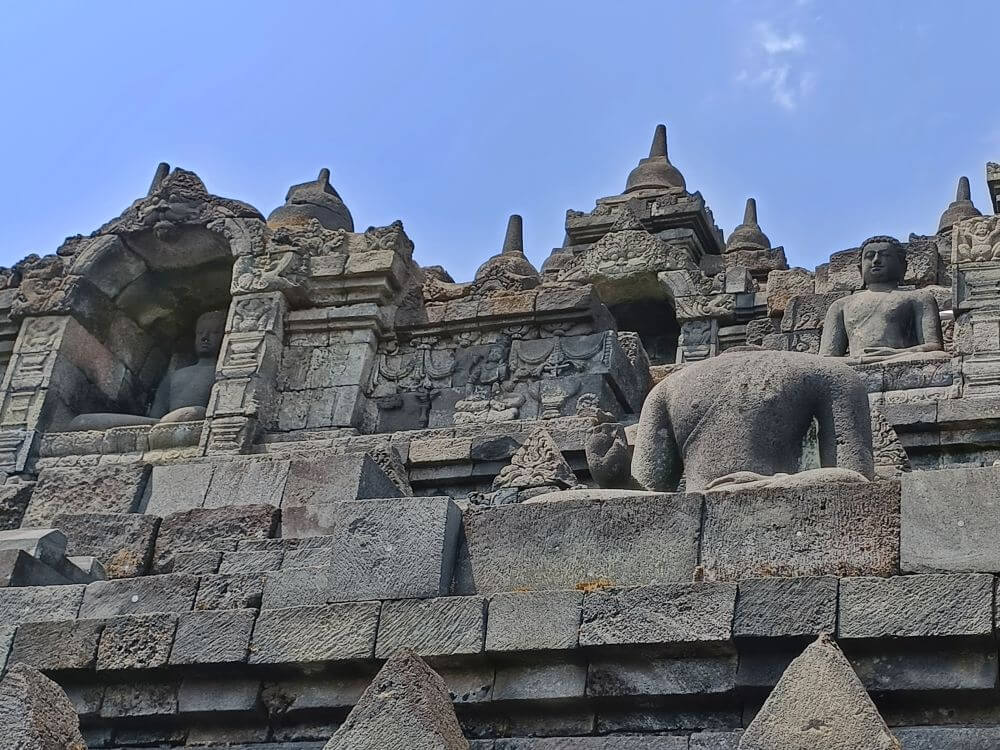 A few of the hundreds of stone Buddha statues that used to adorn the Borobudur temple