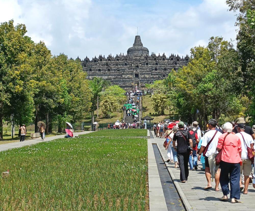 The vast Borobudur temple complex fills the horizon as we approach
